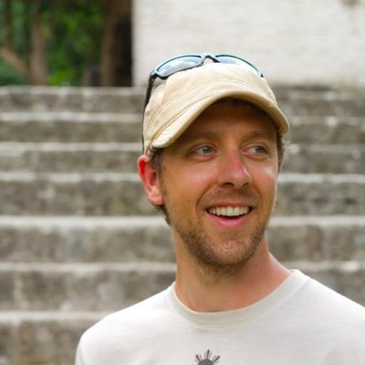 Headshot of Ryan Flach at the Cahal Pech ruins in Belize